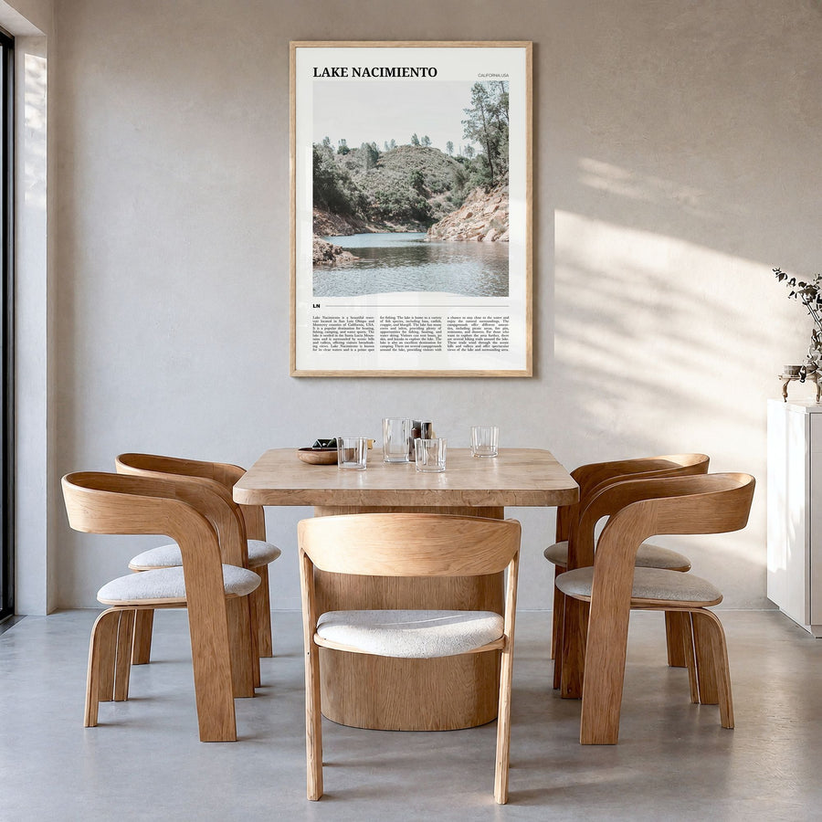 Lake Nacimiento Travel Poster in a natural wood frame, hanging in a dining room