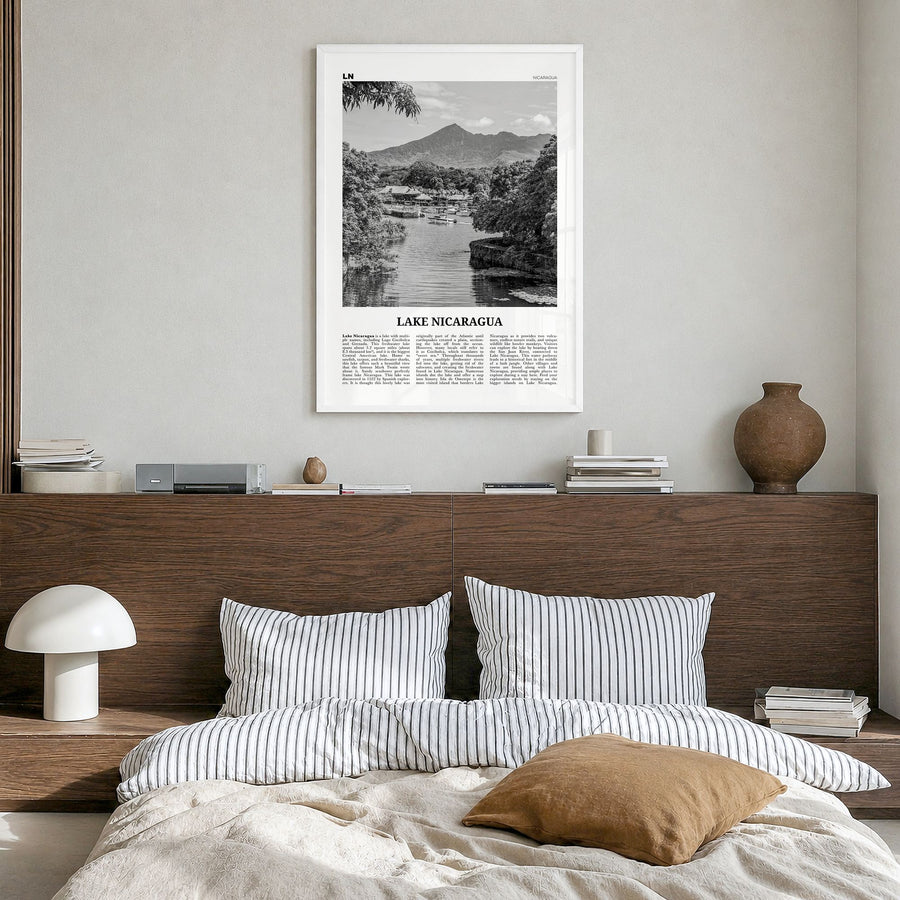 Lake Nicaragua Newspaper Poster in a white wood frame, hanging in a bedroom