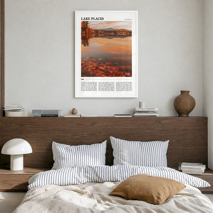 Lake Placid Travel Poster in a white wood frame, hanging in a bedroom