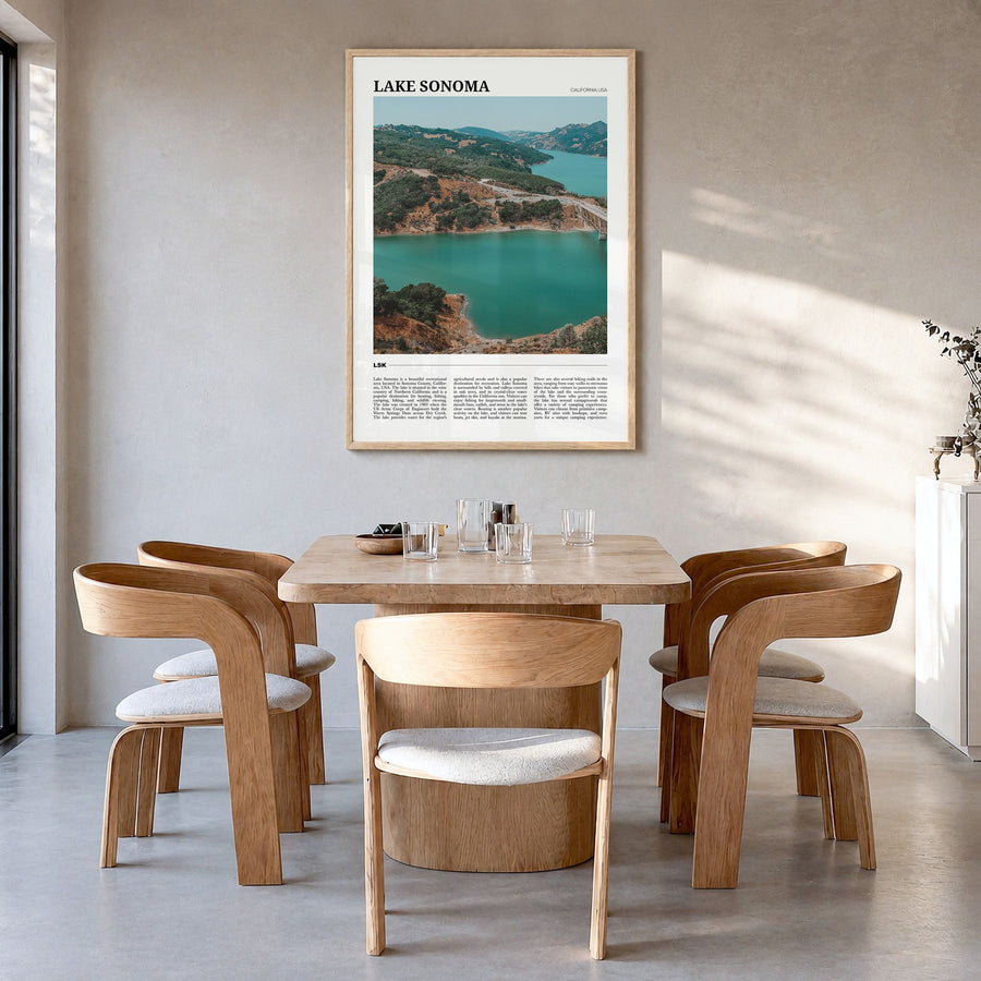 Lake Sonoma Travel Poster in a natural wood frame, hanging in a dining room