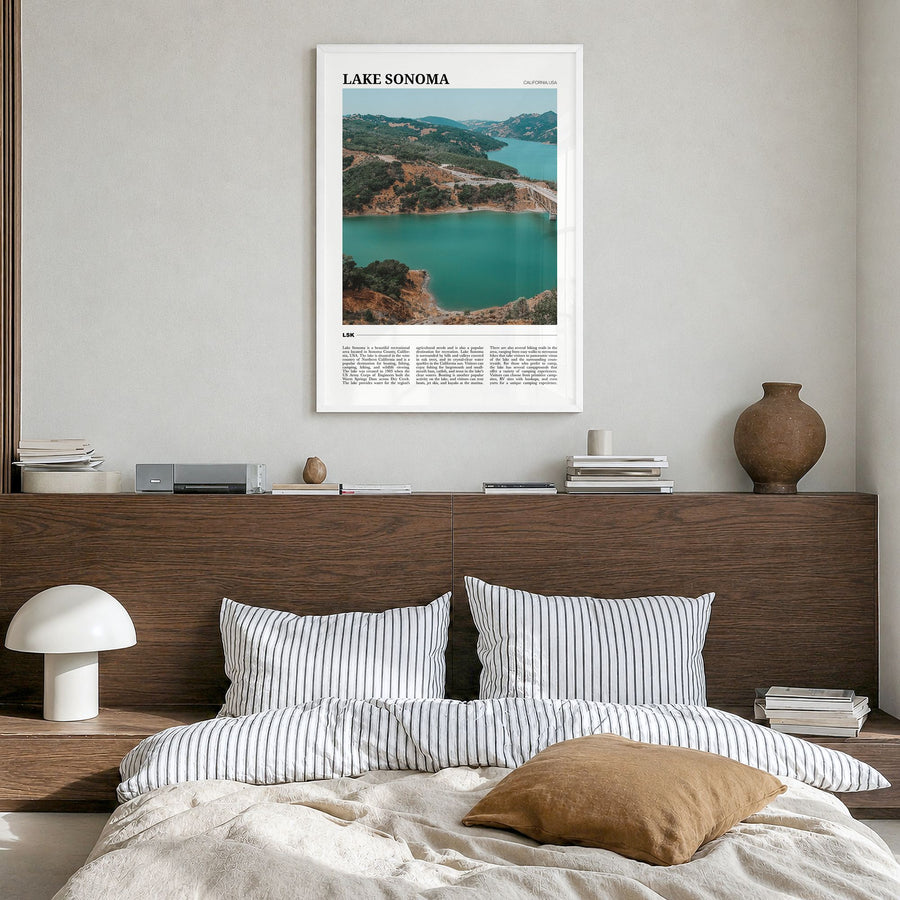 Lake Sonoma Travel Poster in a white wood frame, hanging in a bedroom