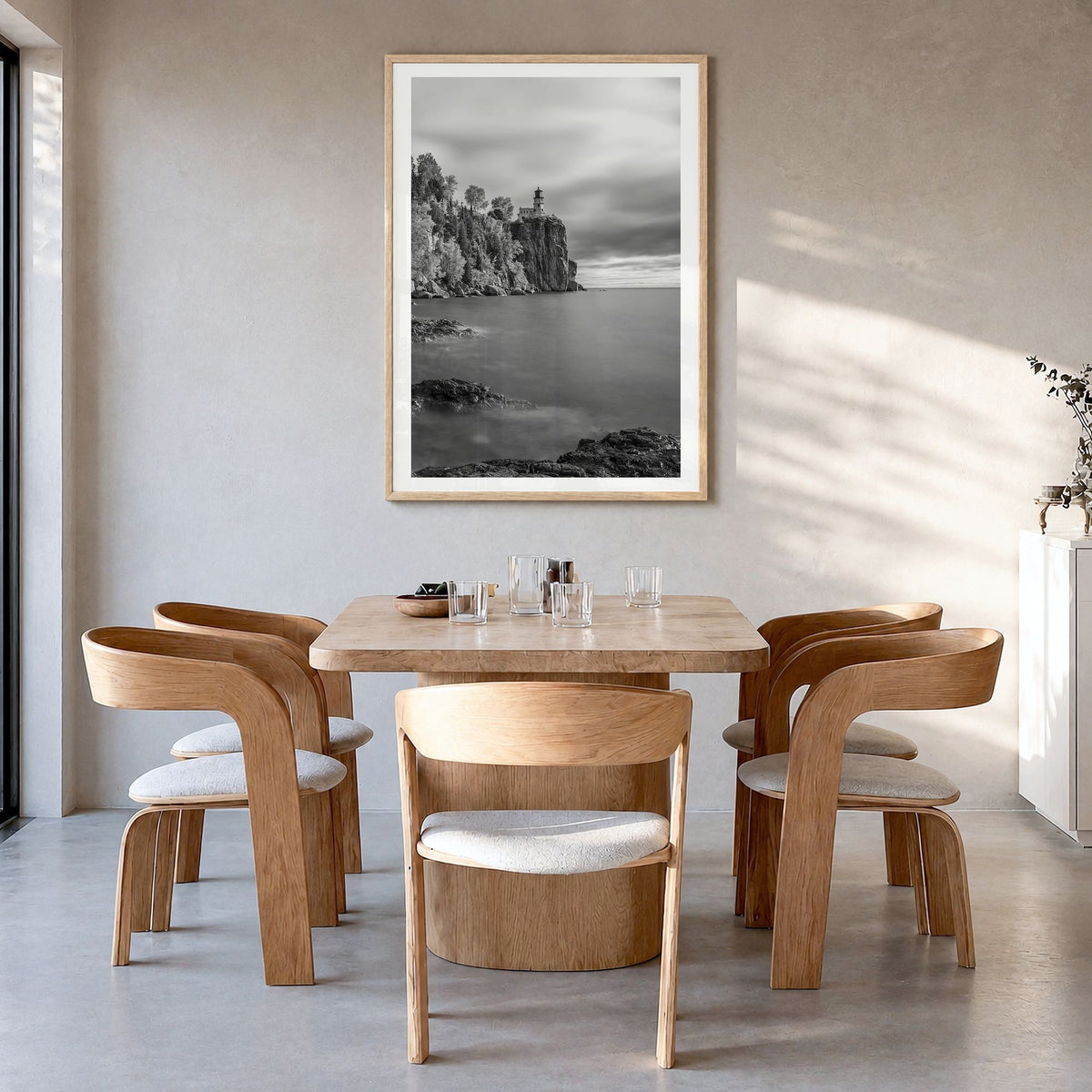 Lake Superior Photo Poster in a natural wood frame, hanging in a dining room, white border