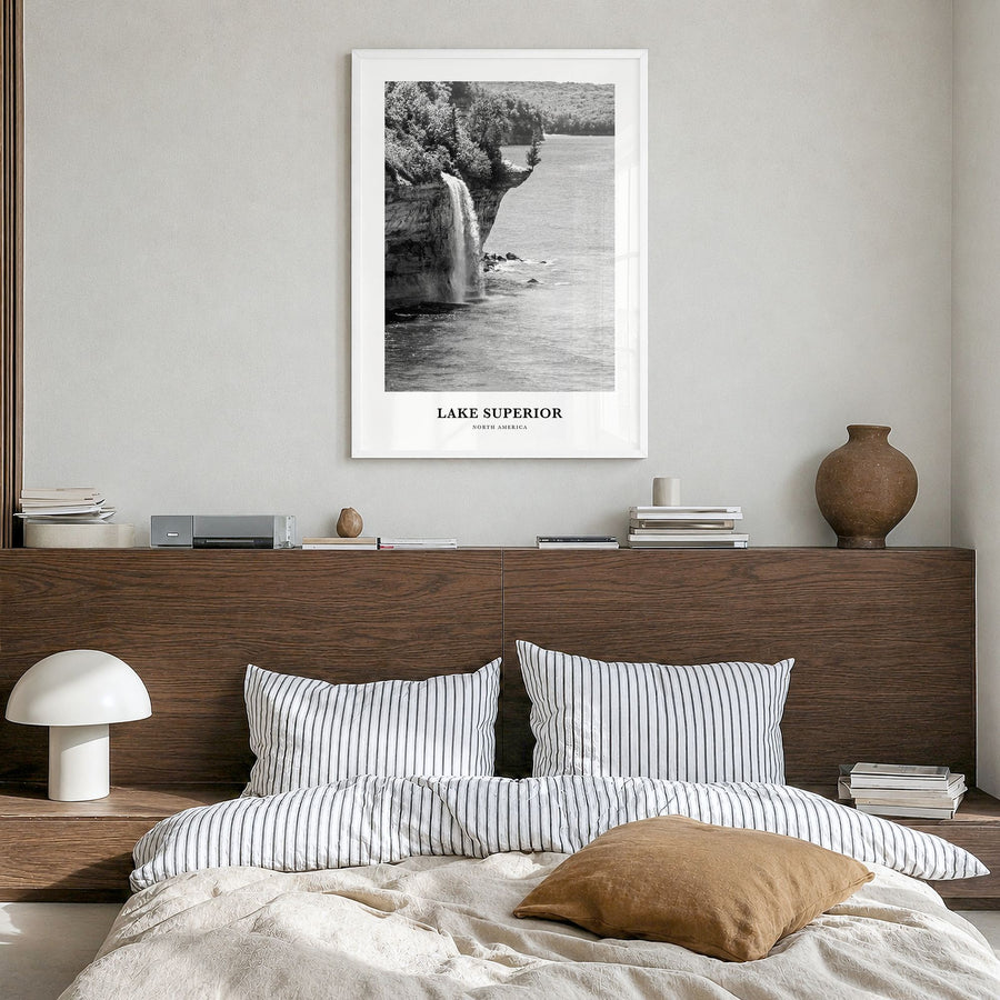 Lake Superior Classic Poster in a white wood frame, hanging in a bedroom