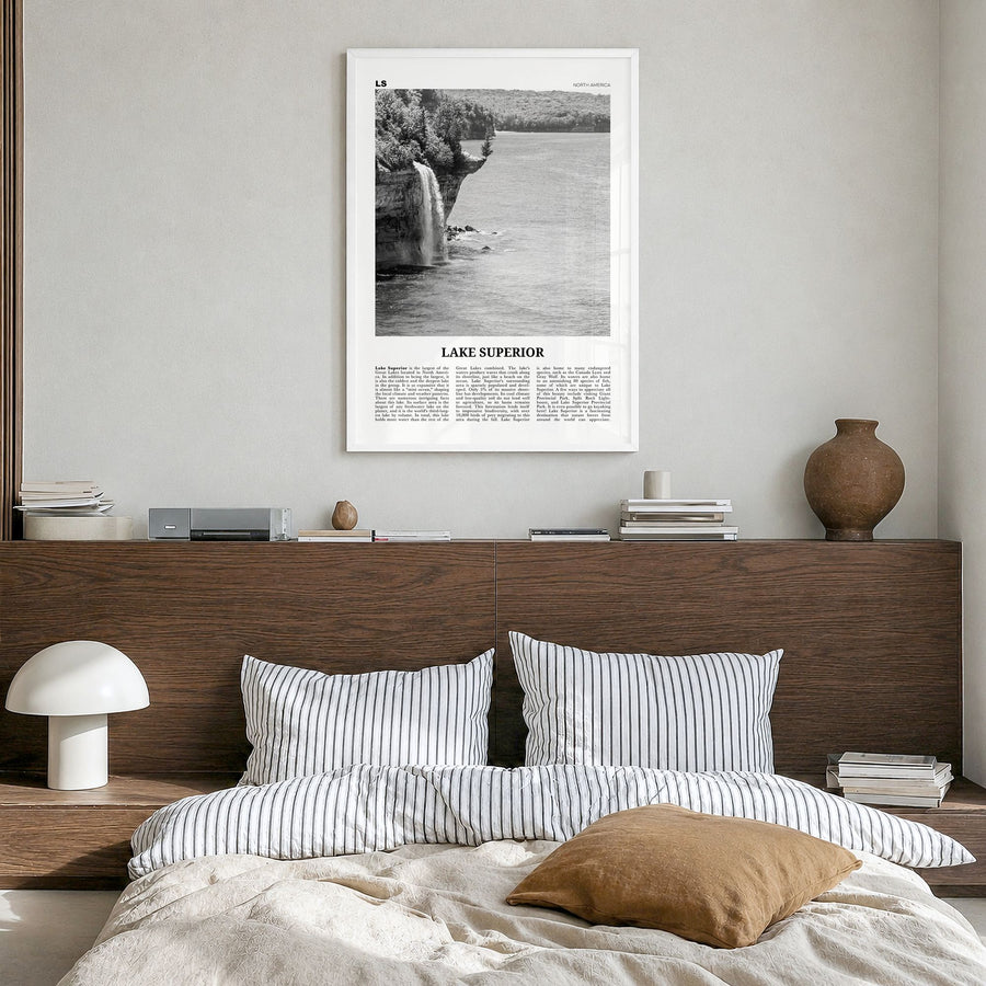 Lake Superior Newspaper Poster in a white wood frame, hanging in a bedroom