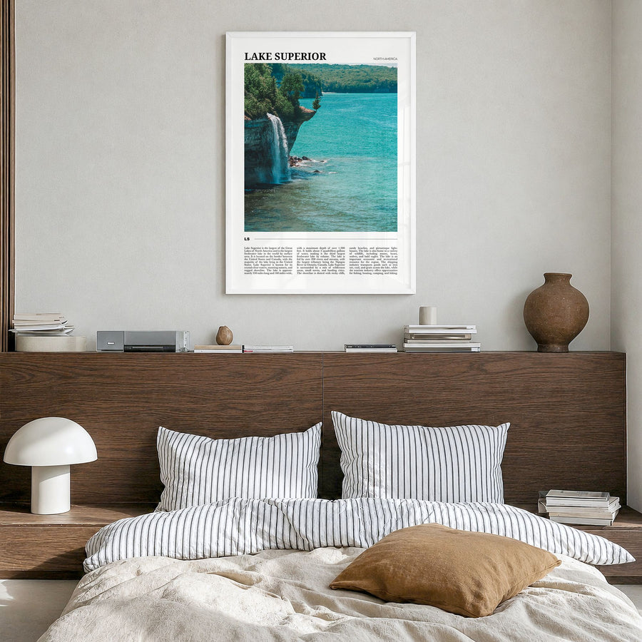 Lake Superior Travel Poster in a white wood frame, hanging in a bedroom