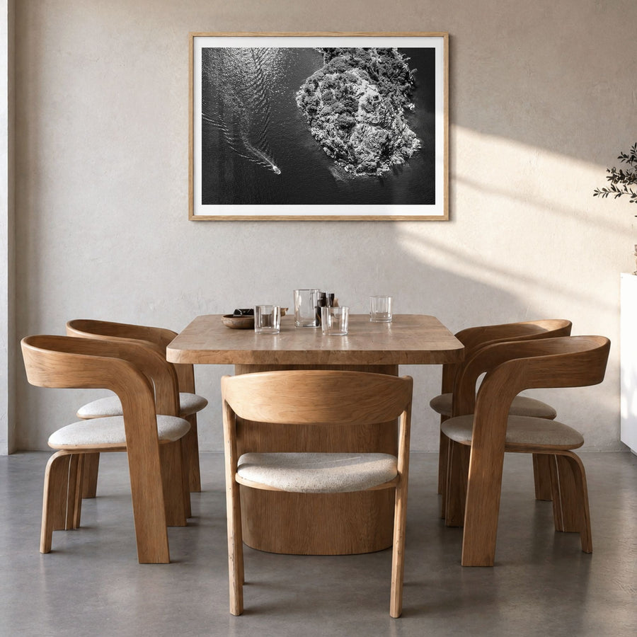 Lake Tahoe Photo Poster in a natural wood frame, hanging in a dining room, white border