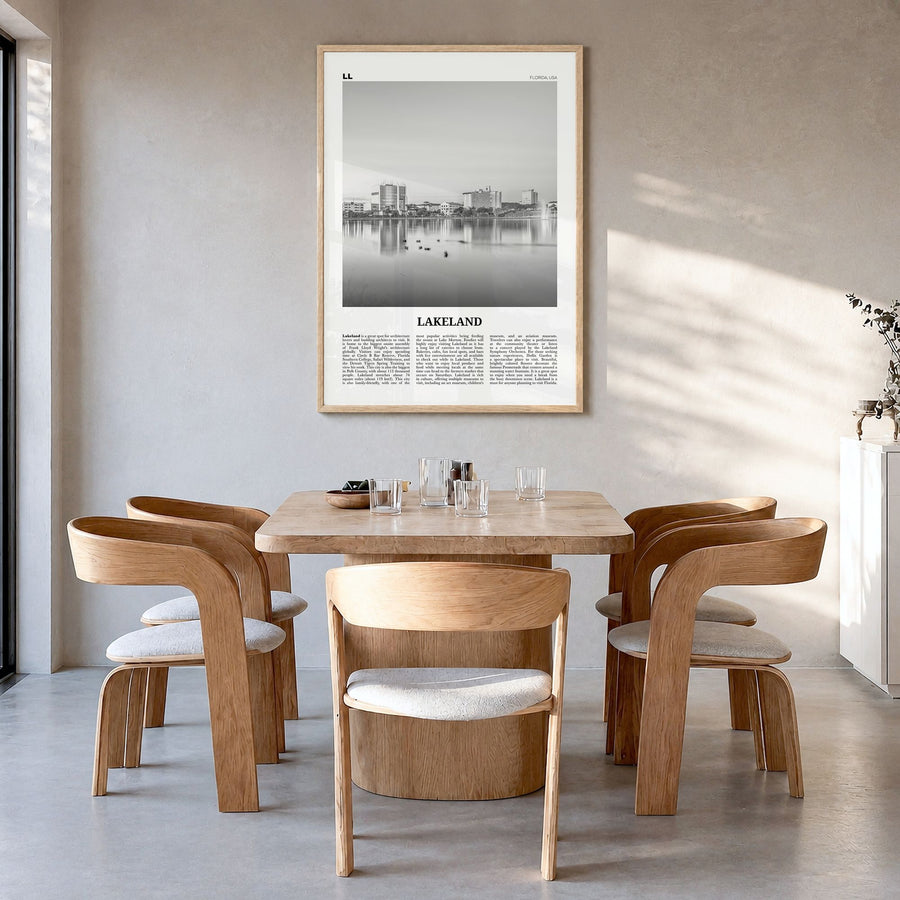 Lakeland Newspaper Poster in a natural wood frame, hanging in a dining room