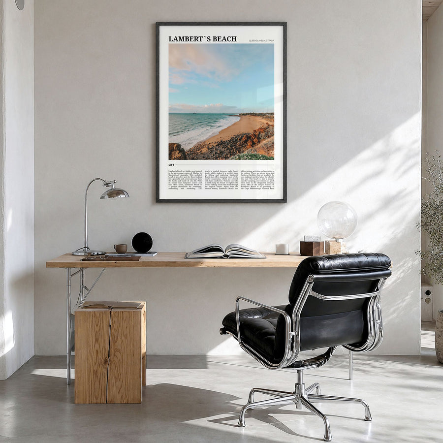 Lambert's Beach Travel Poster in a black wood frame, hanging in a bright home office