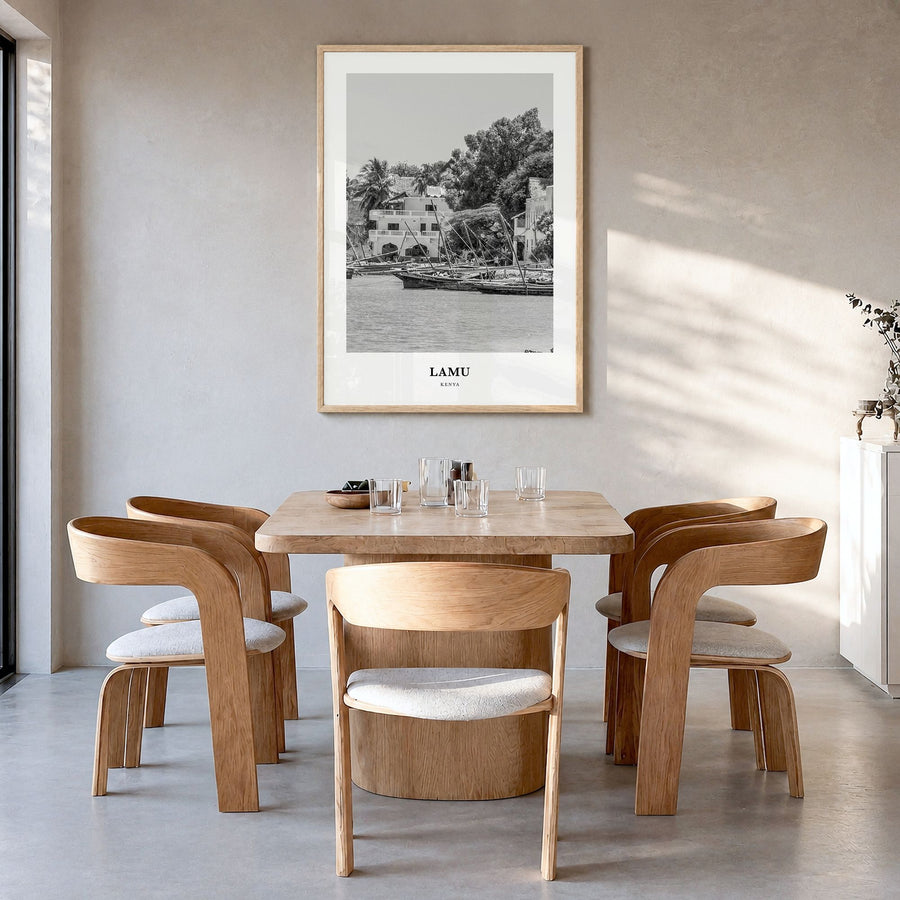 Lamu Classic Poster in a natural wood frame, hanging in a dining room