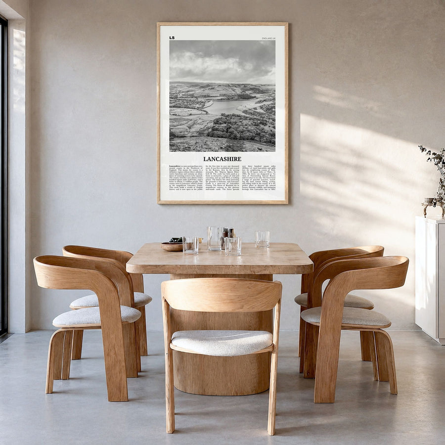 Lancashire Newspaper Poster in a natural wood frame, hanging in a dining room