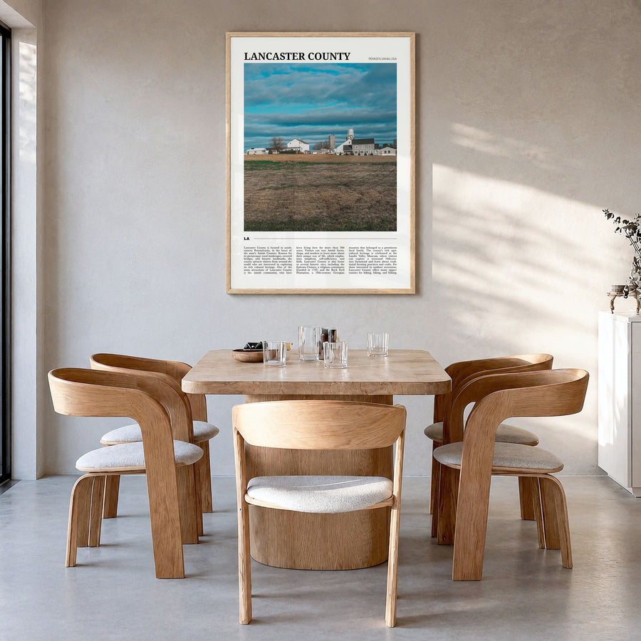 Lancaster County Travel Poster in a natural wood frame, hanging in a dining room