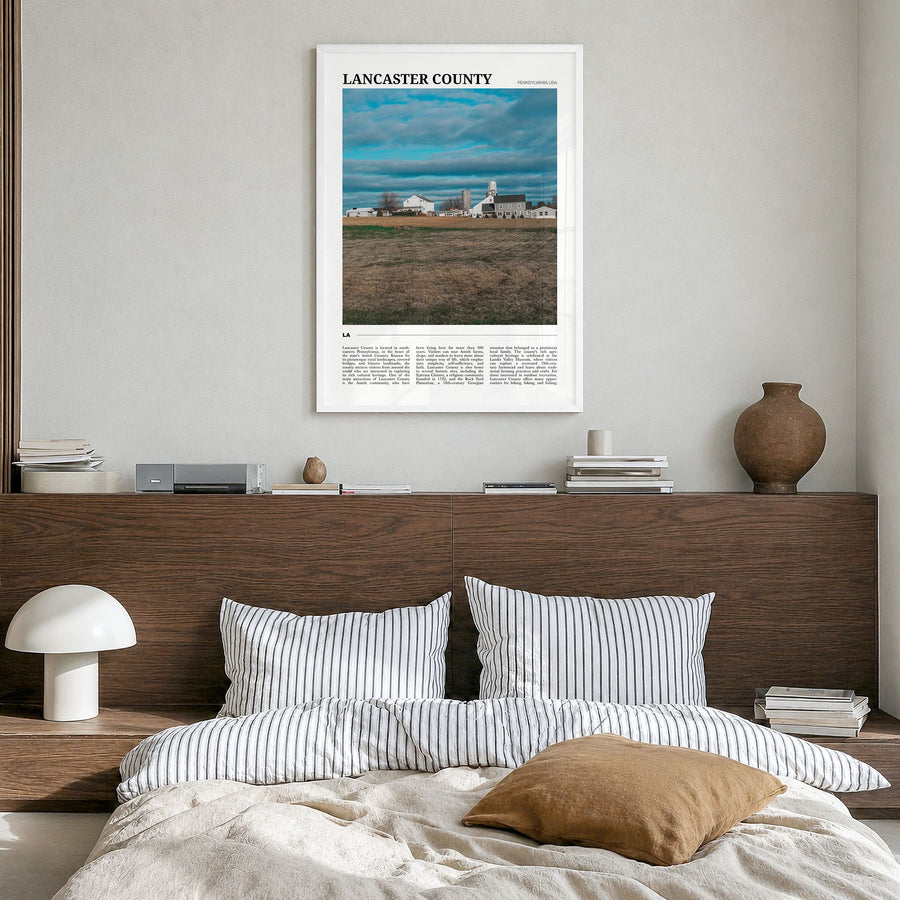 Lancaster County Travel Poster in a white wood frame, hanging in a bedroom
