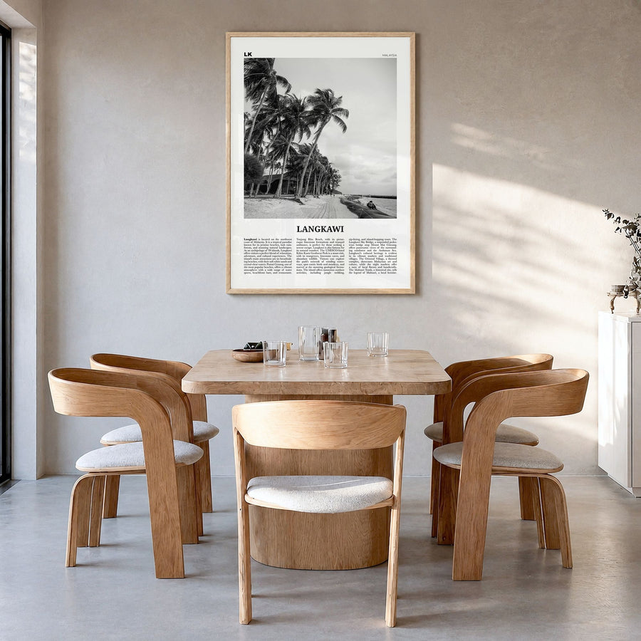 Langkawi Newspaper Poster in a natural wood frame, hanging in a dining room