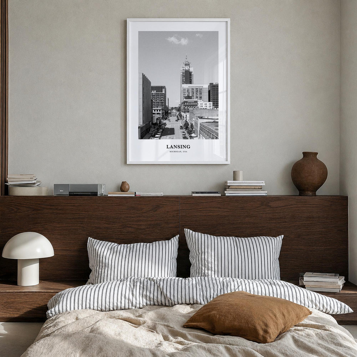 Lansing black & white classic poster of Michigan, USA – vertical wall art in white wood frame, hanging on wall