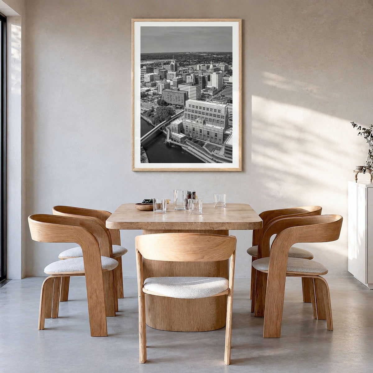Lansing Photo Poster in a natural wood frame, hanging in a dining room, white border