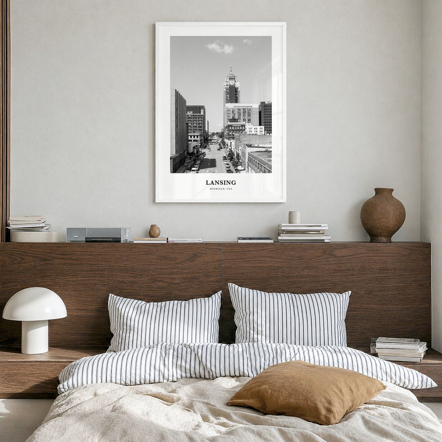 Lansing Classic Poster in a white wood frame, hanging in a bedroom