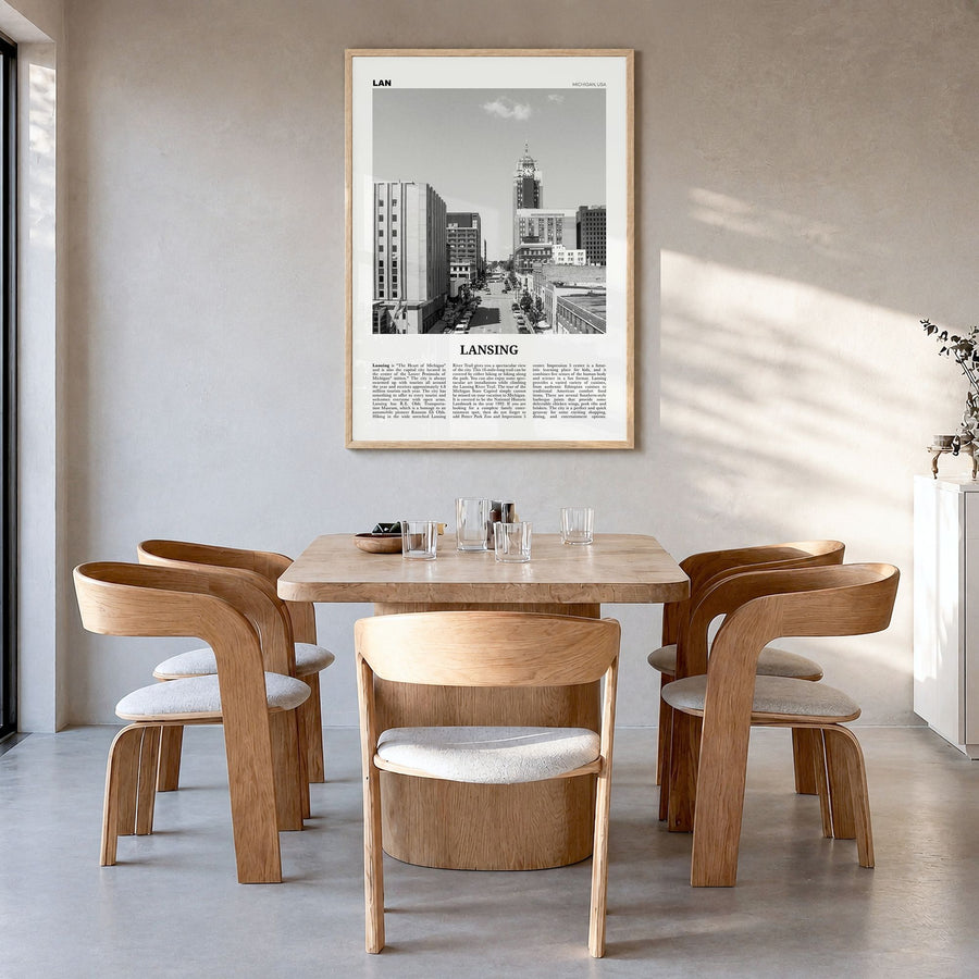 Lansing Newspaper Poster in a natural wood frame, hanging in a dining room