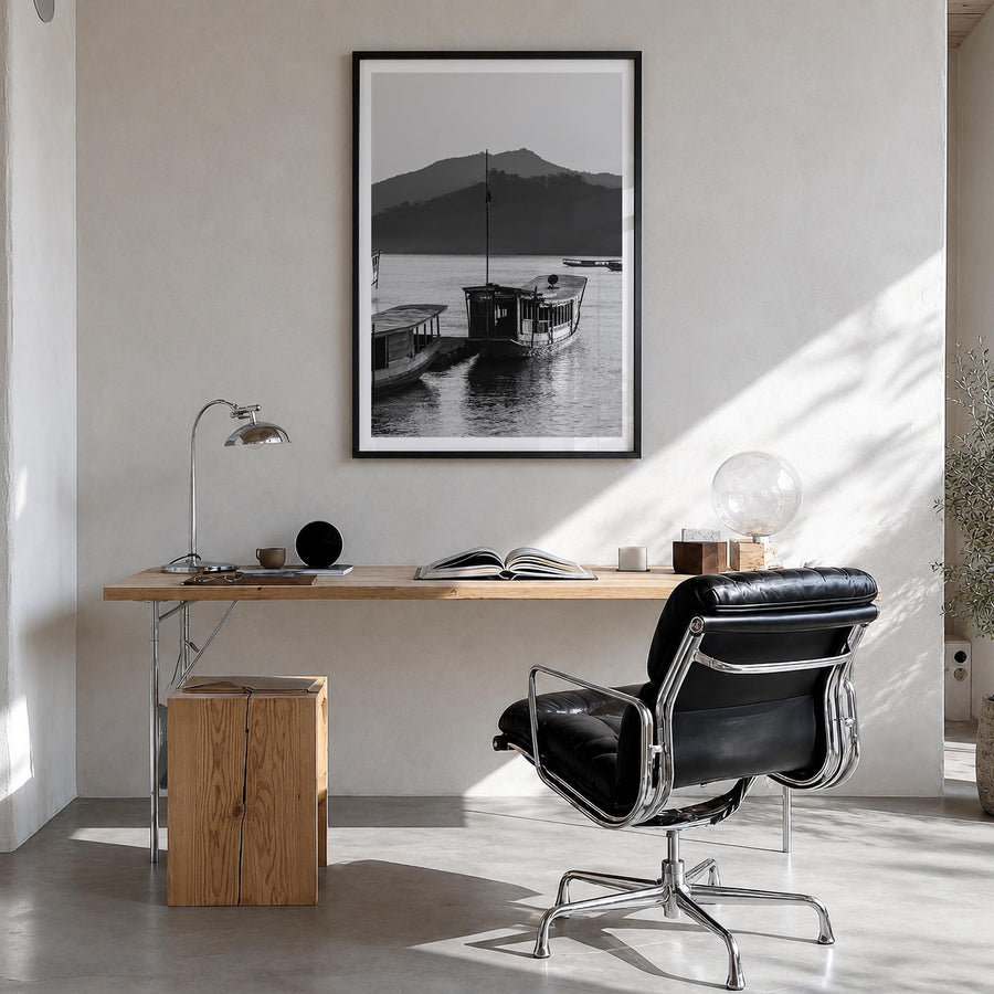 Laos black & white photo poster of Asia – vertical wall art in black wood frame with white border, hanging on wall