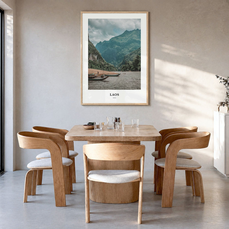 Laos Classic Poster in a natural wood frame, hanging in a dining room