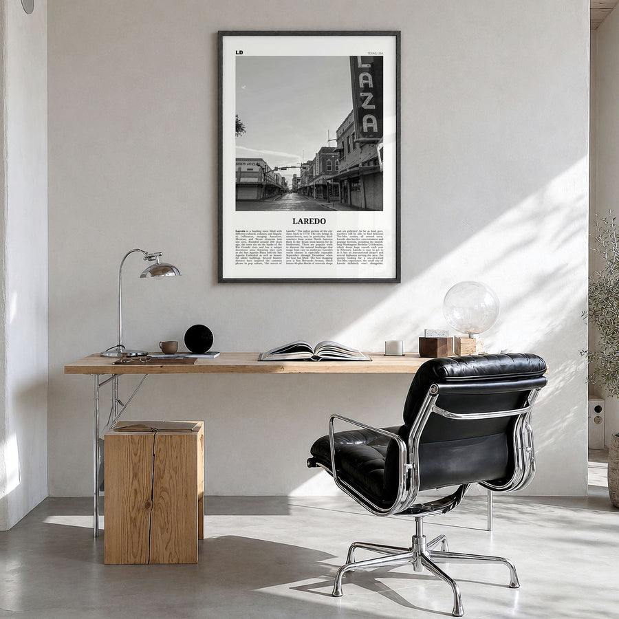 Laredo, Texas Newspaper Poster in a black wood frame, hanging in a bright home office
