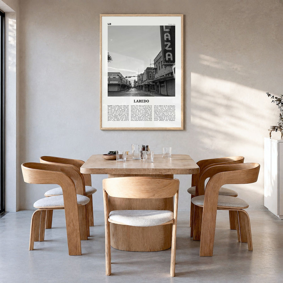 Laredo, Texas Newspaper Poster in a natural wood frame, hanging in a dining room