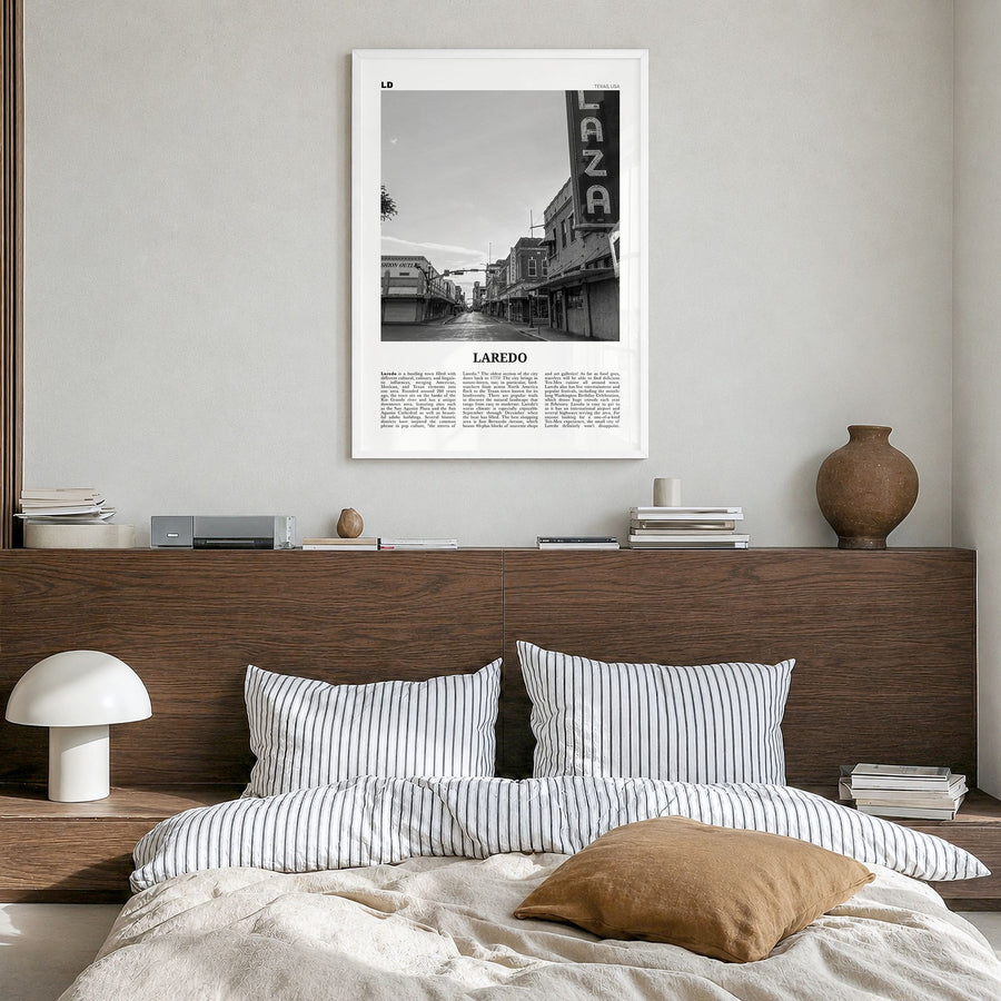 Laredo, Texas Newspaper Poster in a white wood frame, hanging in a bedroom