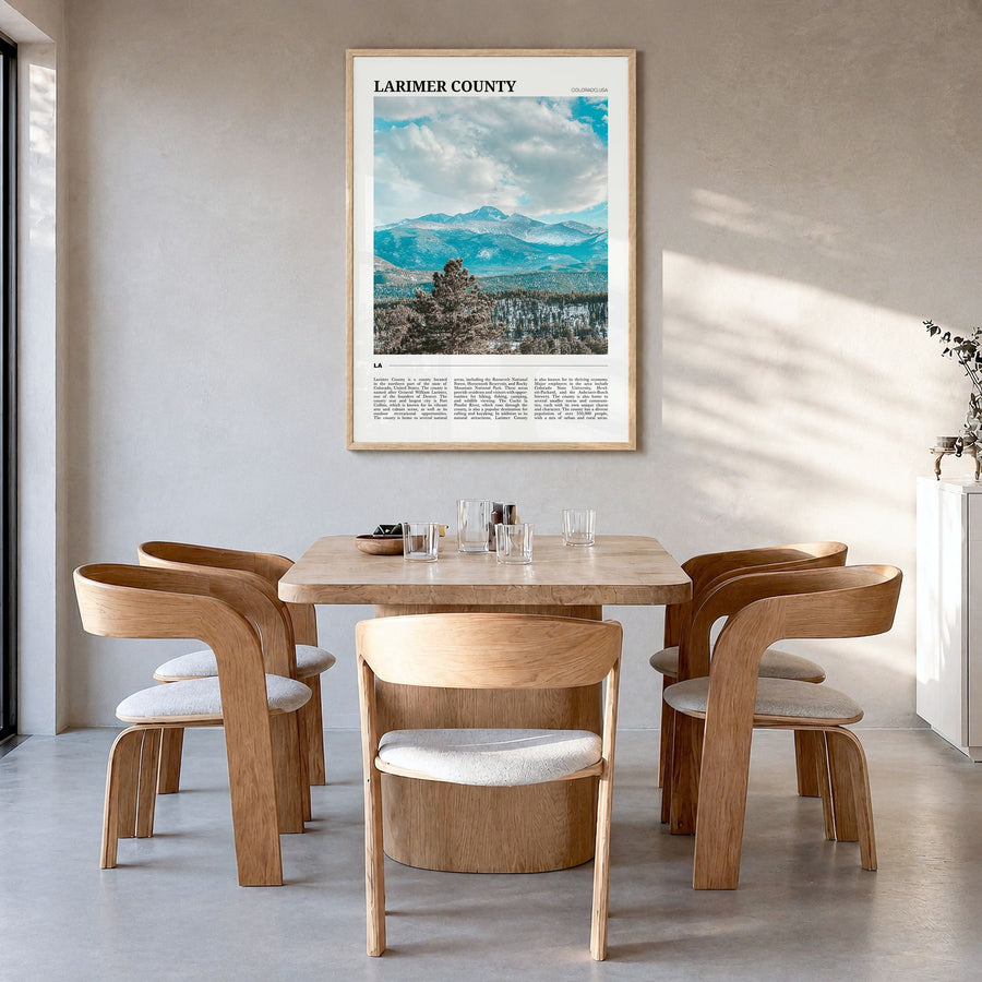 Larimer County Travel Poster in a natural wood frame, hanging in a dining room
