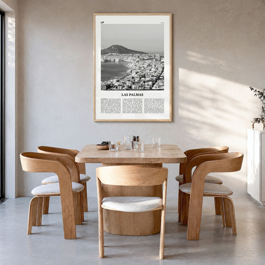 Las Palmas Newspaper Poster in a natural wood frame, hanging in a dining room