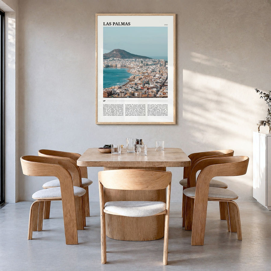 Las Palmas Travel Poster in a natural wood frame, hanging in a dining room