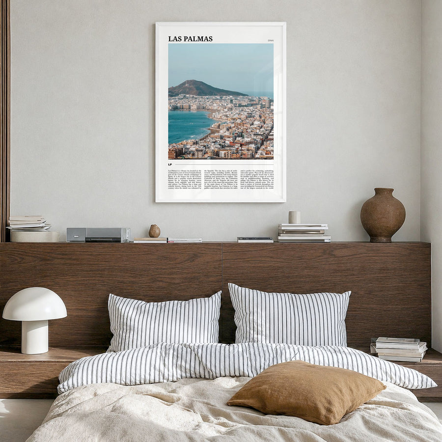 Las Palmas Travel Poster in a white wood frame, hanging in a bedroom