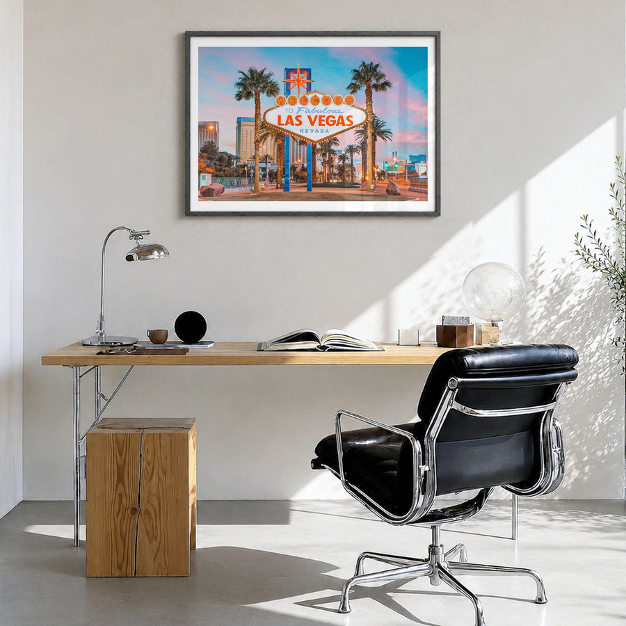 Las Vegas Photo Poster in a black wood frame, hanging in a bright home office, white border