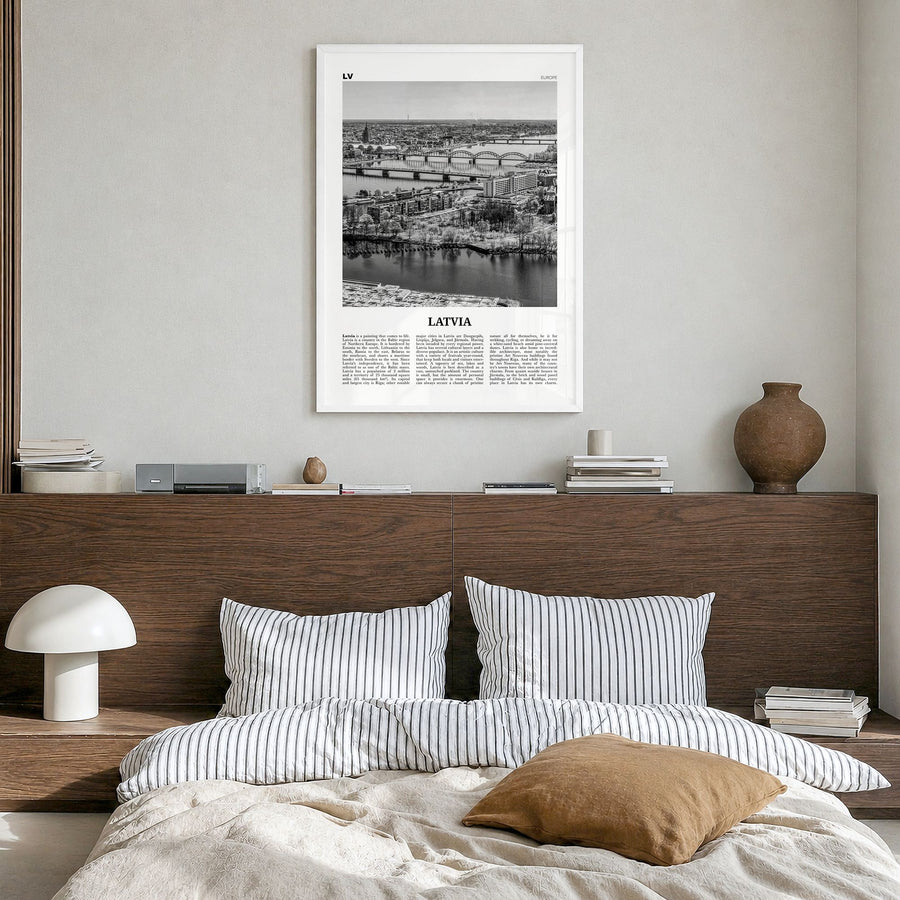 Latvia Newspaper Poster in a white wood frame, hanging in a bedroom