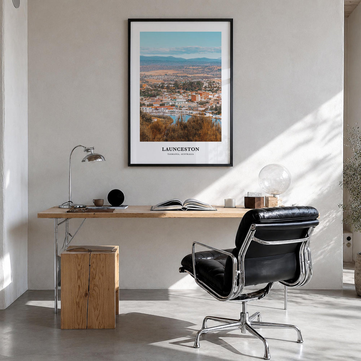 Launceston colorful classic poster of Australia – vertical wall art in black wood frame, hanging on wall