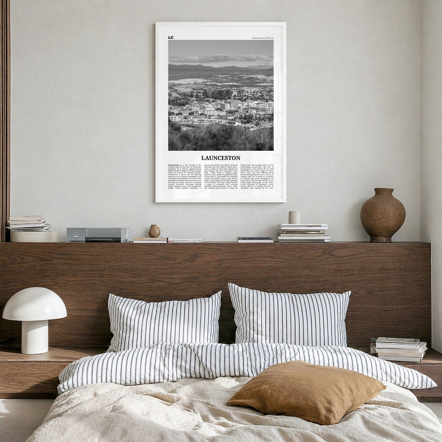 Launceston Newspaper Poster in a white wood frame, hanging in a bedroom