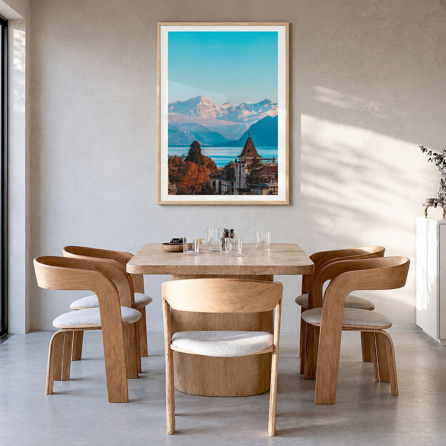 Lausanne Photo Poster in a natural wood frame, hanging in a dining room, white border