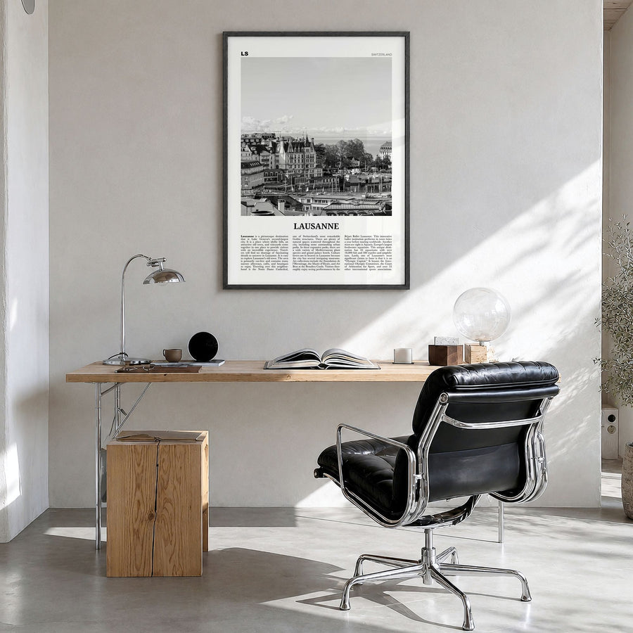 Lausanne Newspaper Poster in a black wood frame, hanging in a bright home office