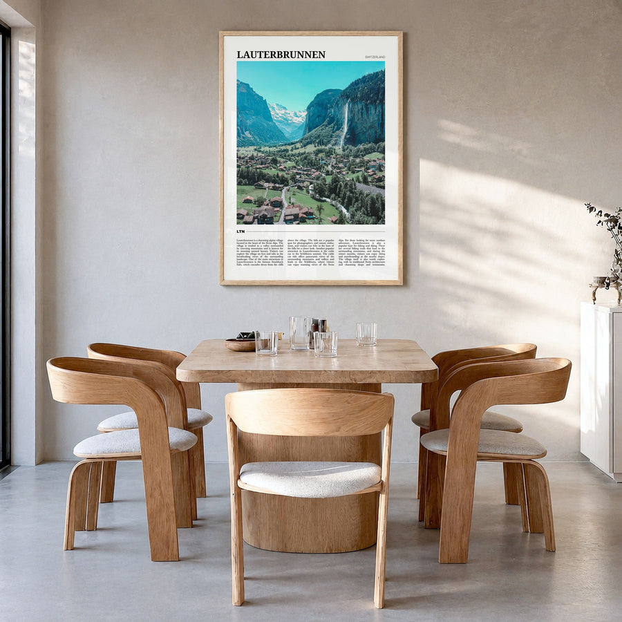 Lauterbrunnen Travel Poster in a natural wood frame, hanging in a dining room