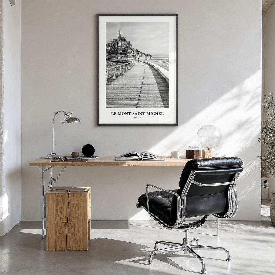 Le Mont-Saint-Michel Classic Poster in a black wood frame, hanging in a bright home office