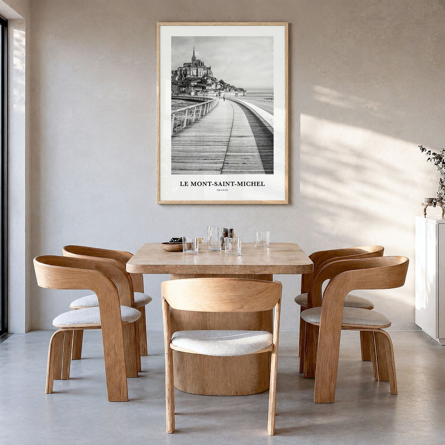 Le Mont-Saint-Michel Classic Poster in a natural wood frame, hanging in a dining room