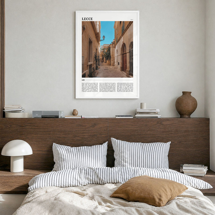Lecce Travel Poster in a white wood frame, hanging in a bedroom