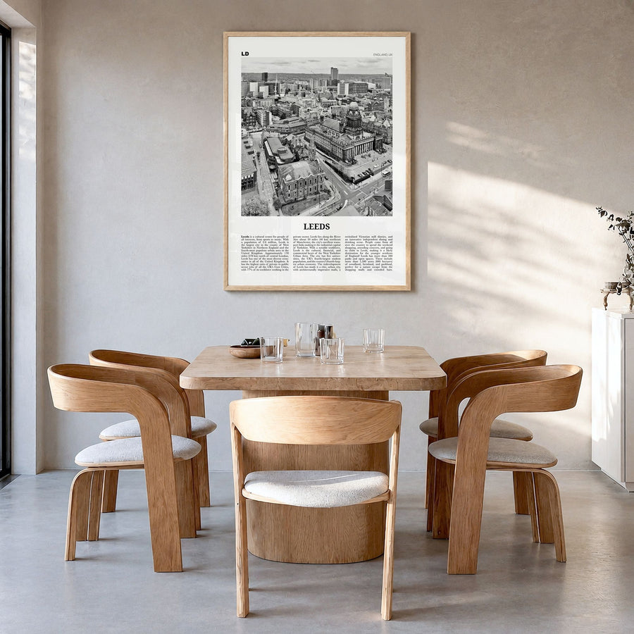 Leeds Newspaper Poster in a natural wood frame, hanging in a dining room
