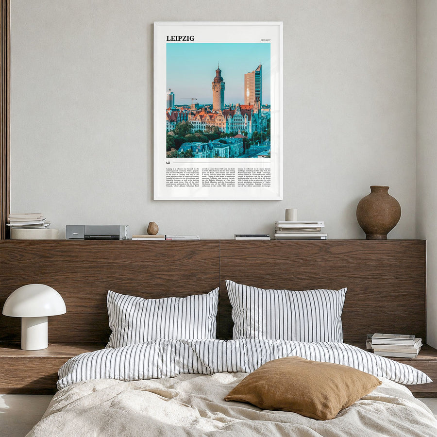 Leipzig Travel Poster in a white wood frame, hanging in a bedroom