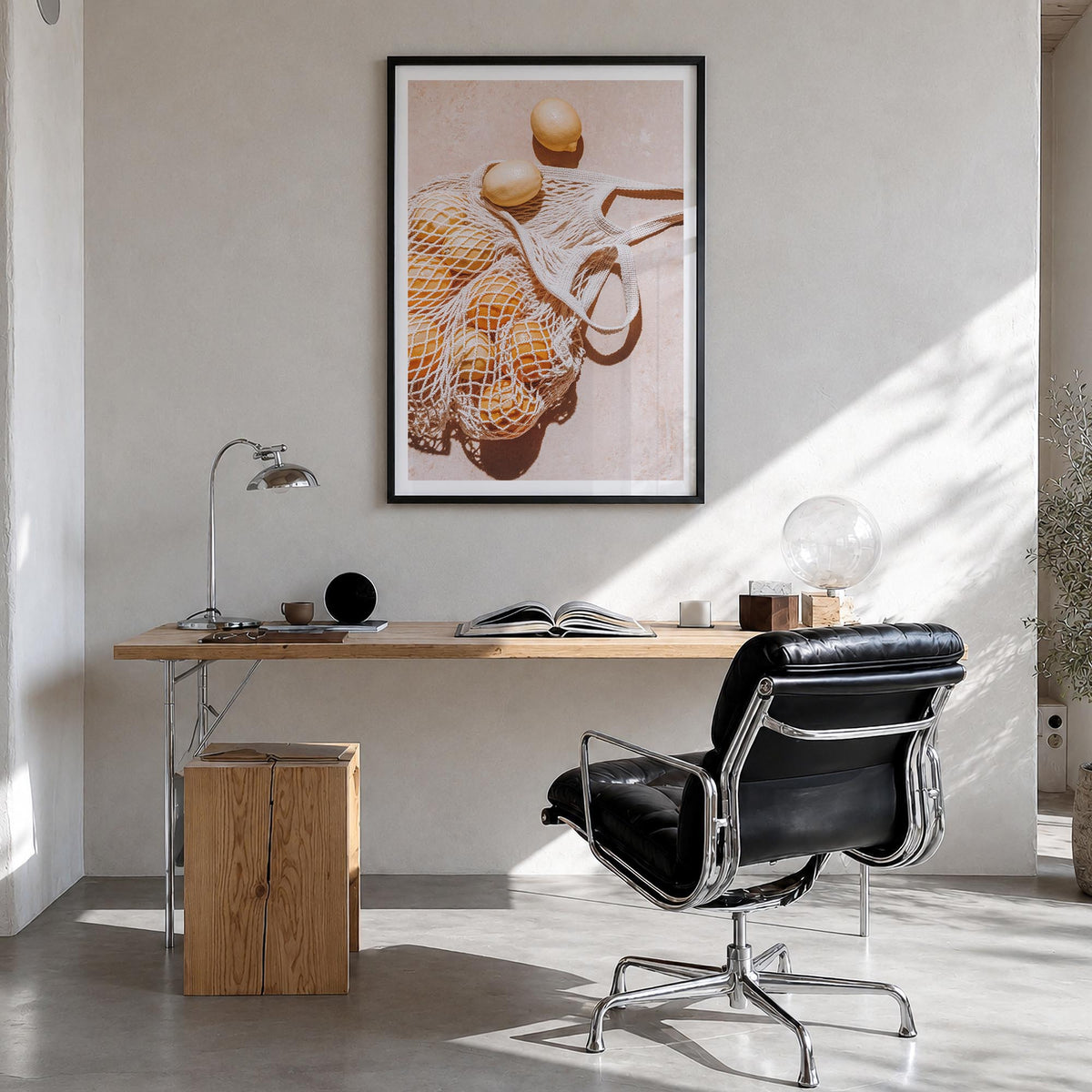 Lemons no. 1 colorful photo poster – vertical wall art in black wood frame with white border, hanging on wall