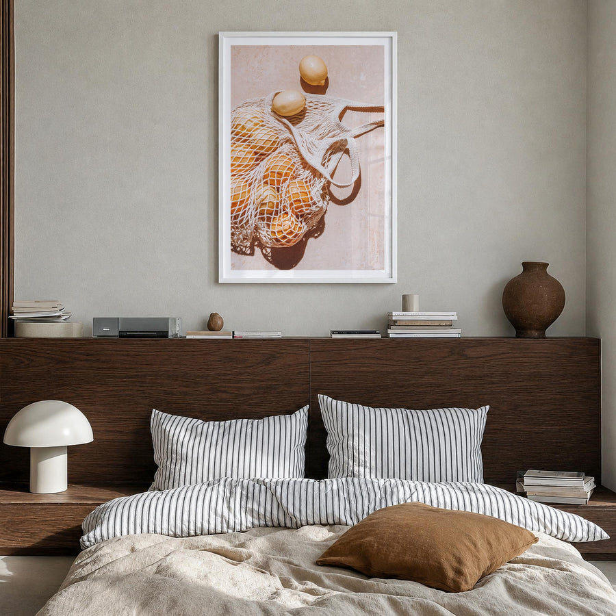 Lemons no. 1 colorful photo poster – vertical wall art in white wood frame with white border, hanging on wall