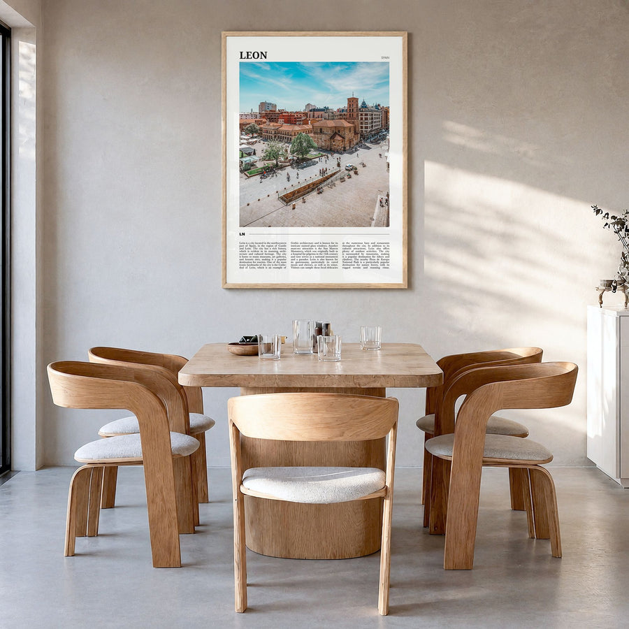 León Travel No 1 Poster in a natural wood frame, hanging in a dining room