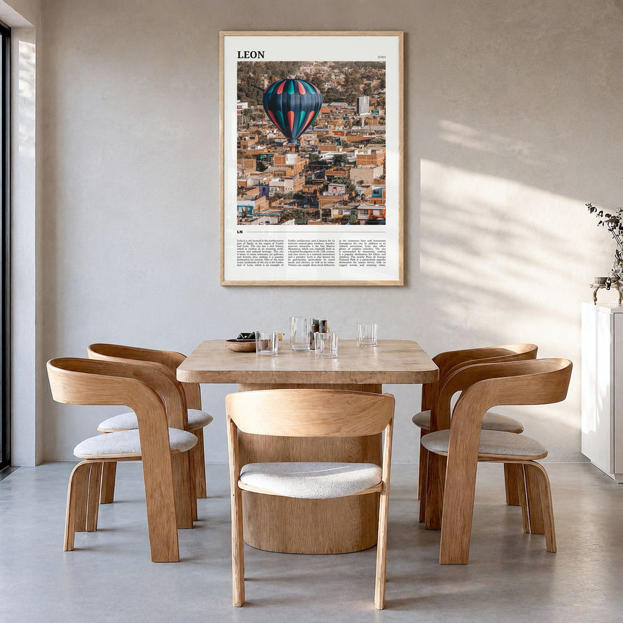 León Travel No 2 Poster in a natural wood frame, hanging in a dining room