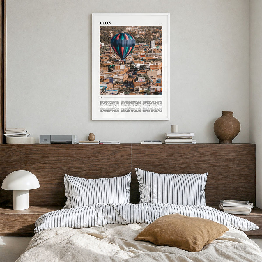 León Travel No 2 Poster in a white wood frame, hanging in a bedroom