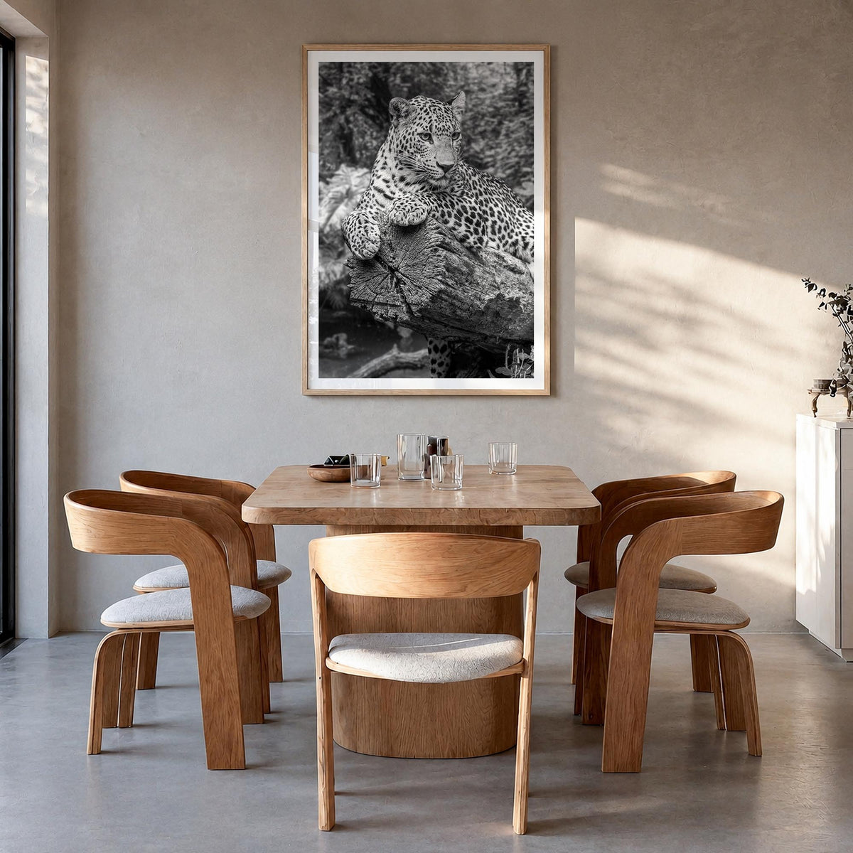 Leopard no. 2 black & white photo poster – vertical wall art in natural wood frame with white border, hanging on wall