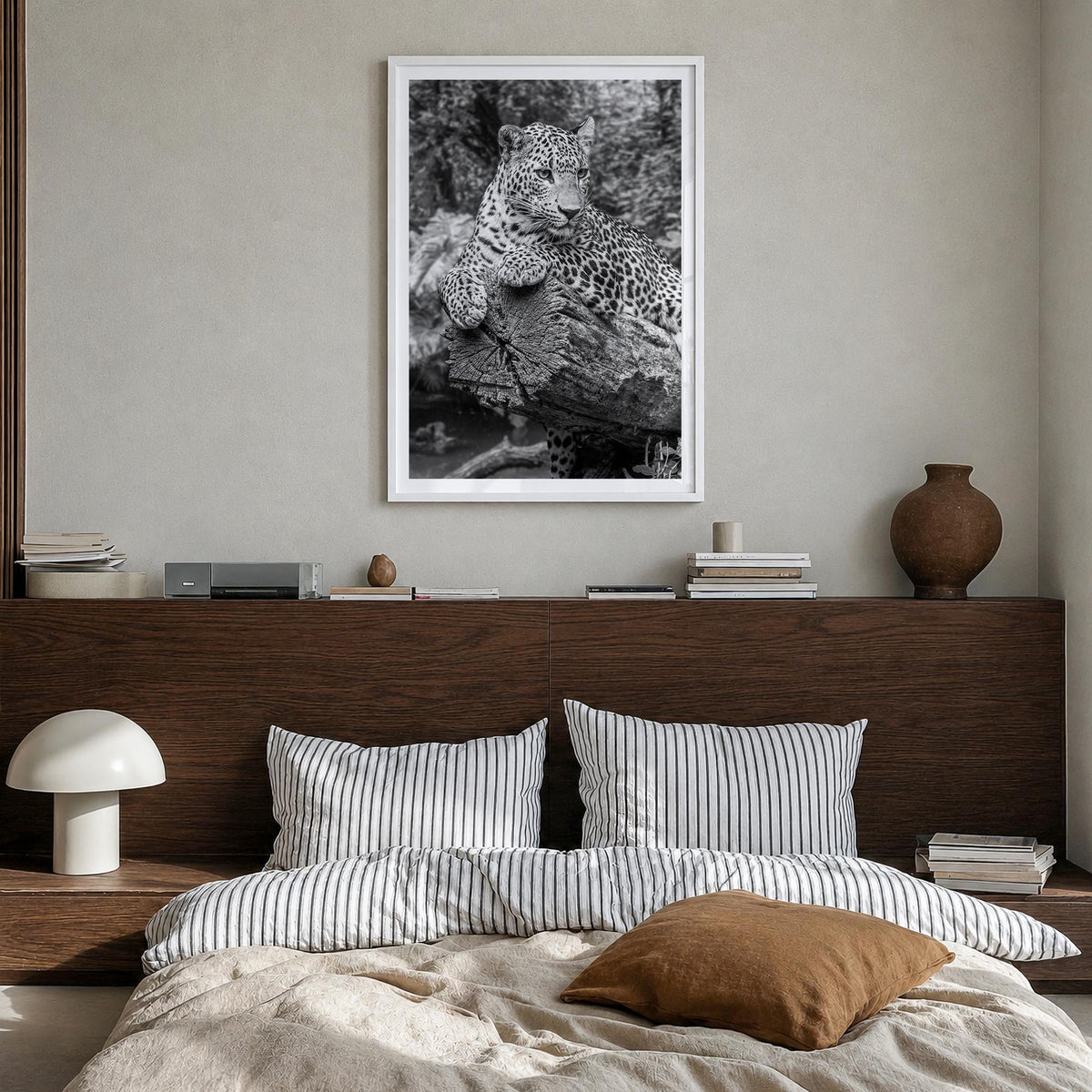 Leopard no. 2 black & white photo poster – vertical wall art in white wood frame with white border, hanging on wall