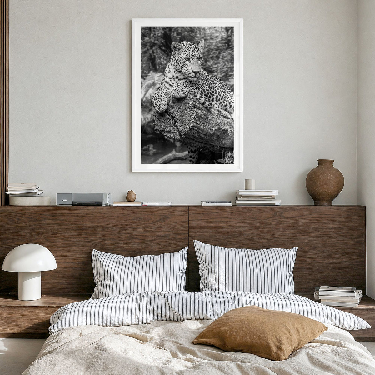 Leopard Photo No 2 Poster in a white wood frame, hanging in a bedroom, white border